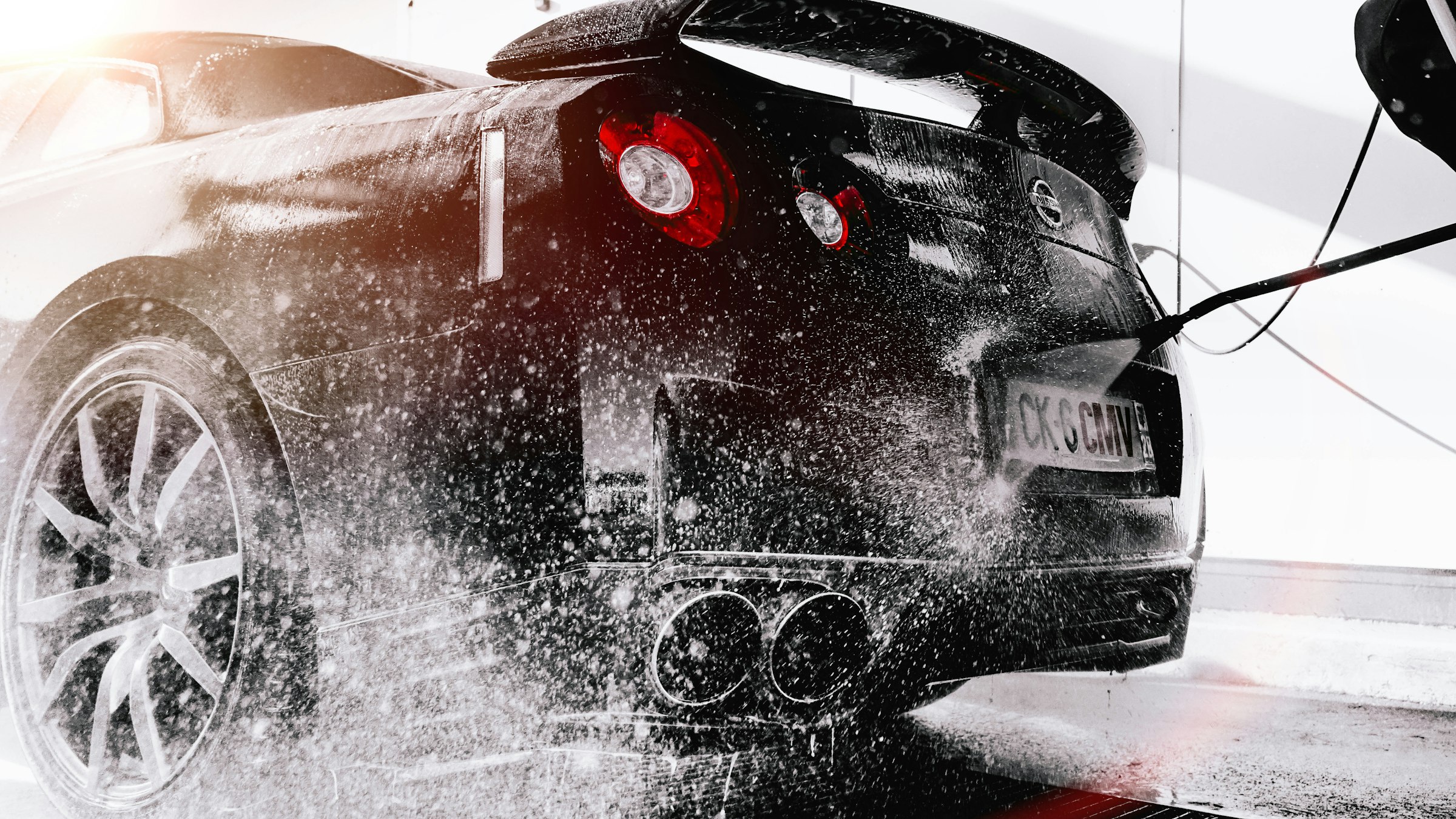 Black performance car photographed in monochrome
