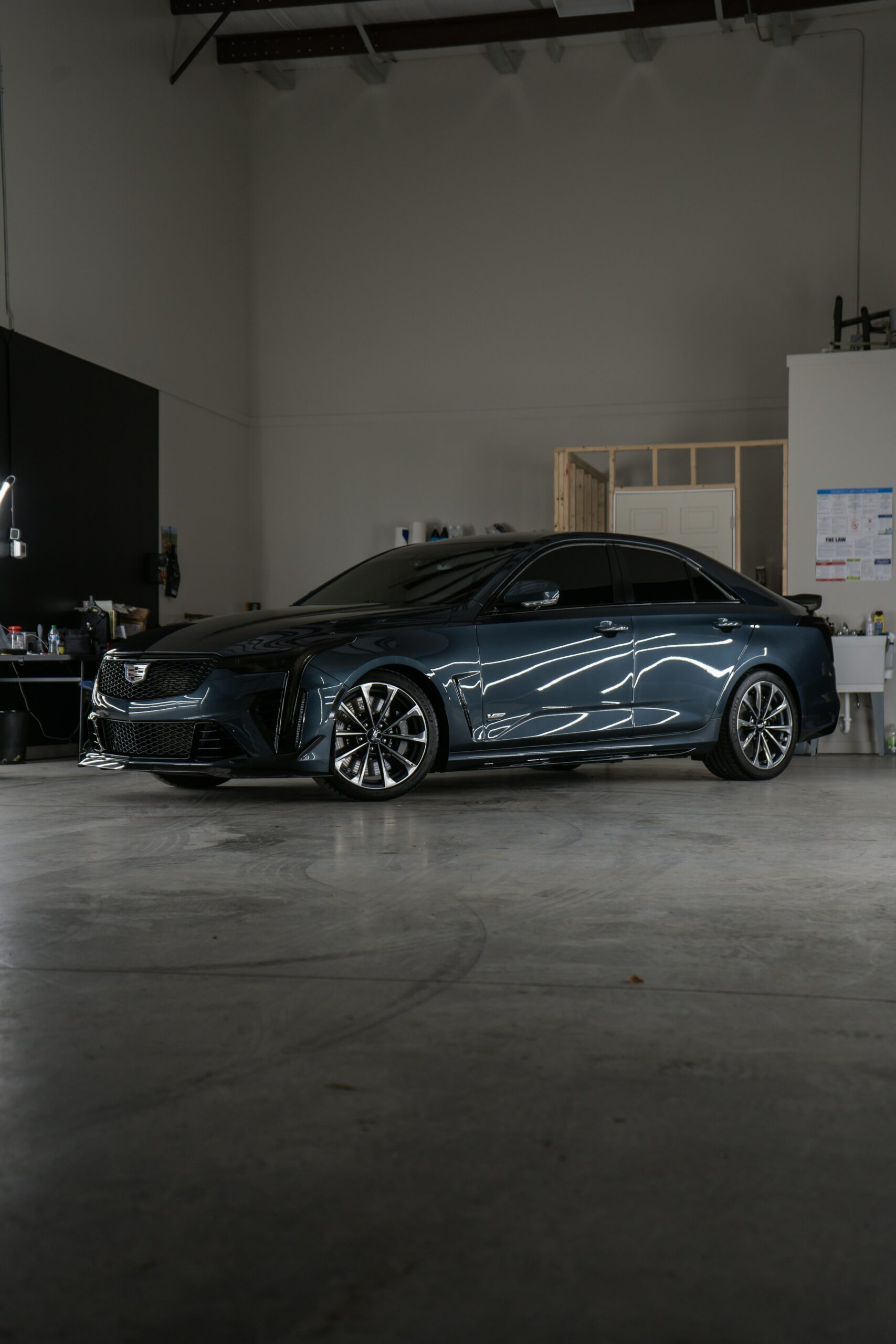 Car parked inside a detailing garage
