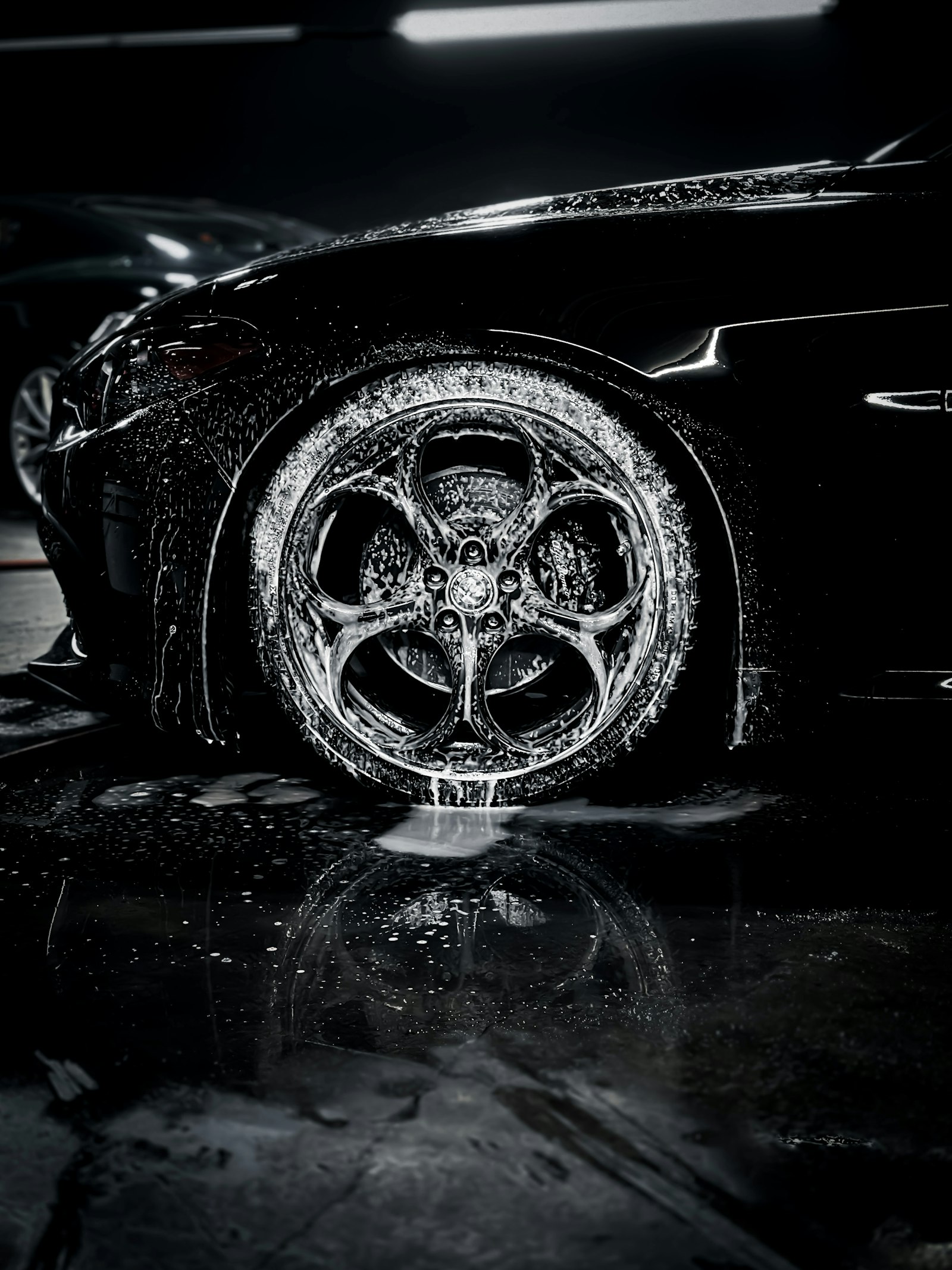 Close-up of a car tyre on a wet surface