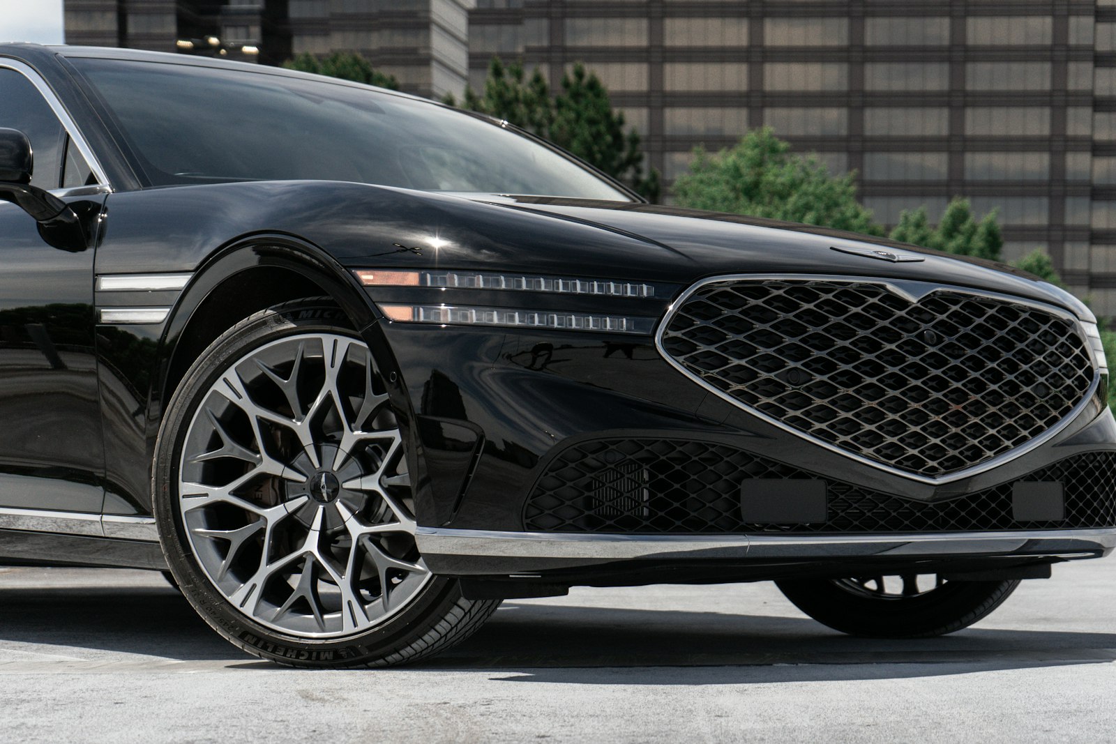 Glossy black car parked outdoors