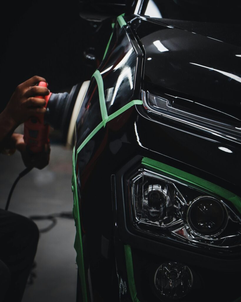 Hands on a car steering wheel inside a clean cabin
